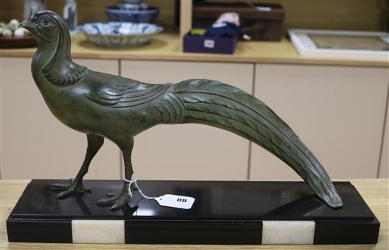 A French patinated spelter model of a pheasant on black marble base, signed M. Fone length 52cm